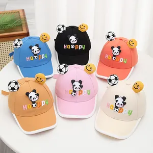 Detail of children's baseball caps featuring 3D panda dolls and colorful Happy embroidery