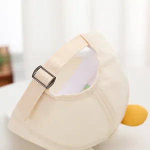 Kids baseball cap in beige cotton twill featuring an adjustable metal buckle strap