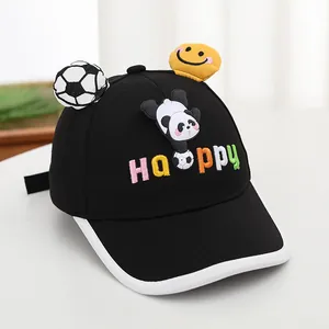 Detail of kids baseball cap featuring cartoon panda, football, and Happy embroidery