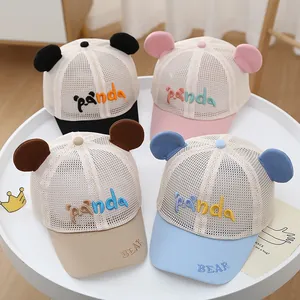 Close-up of breathable mesh baby baseball caps with 3D ears and panda embroidery
