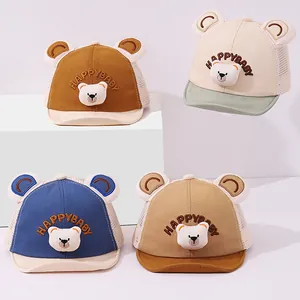 Collection of baby mesh baseball caps in brown, cream, blue, and khaki with bear ears
