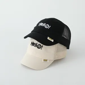 Detail of toddler mesh baseball cap showing breathable net and 3D bear smiley embroidery
