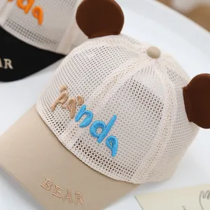 Detailed shot of breathable mesh texture and cute 3D bear ears on baby summer baseball cap