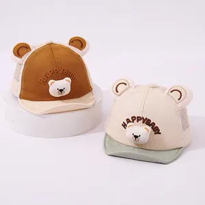 Detail of baby sun hats featuring cute bear patches and breathable mesh panels