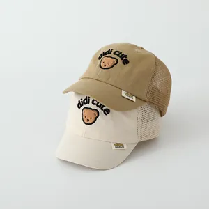 Close-up of mesh summer baseball caps with bear embroidery and breathable fabric