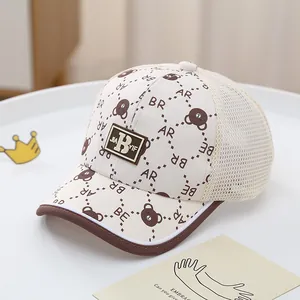 Detailed close-up of breathable mesh back and cute bear patch on children's baseball cap