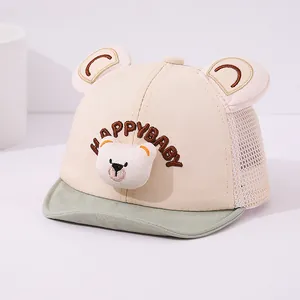 Detail of baby mesh baseball cap with plush bear decor and Happy Baby embroidery