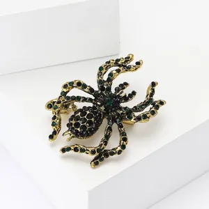 Vintage gold alloy spider brooch with black and green rhinestones for Halloween fashion