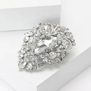 Detailed macro view of high-grade pear-shaped crystal rhinestone brooch for elegant dresses