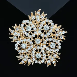 Elegant gold sunflower brooch with radiant rhinestones on a sleek black background