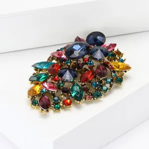Close-up of vintage alloy brooch with colorful multifaceted rhinestones and crystals