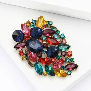 Exquisite vintage style crystal flower brooch with colorful rhinestones on white display