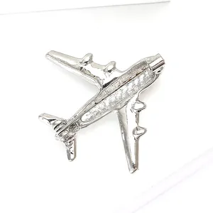Detailed back view of silver aircraft brooch showing secure safety pin clasp mechanism