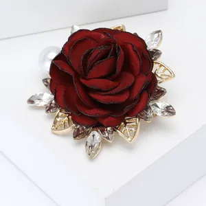 Elegant dark red fabric rose brooch with gold leaves, white pearls and sparkling zircons