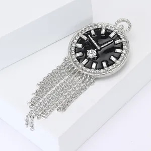 Vintage zilveren zakhorloge broche met zwart emaille, kristallen en kwastjes