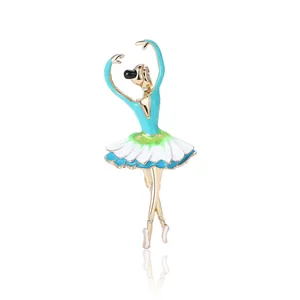 Elegant gold ballerina brooch with colorful enamel petals and crystals on white background