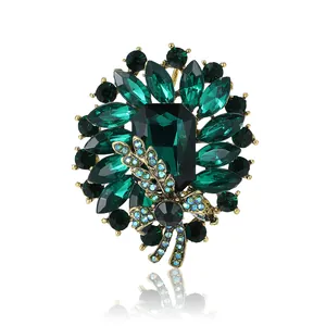 Vintage green crystal brooch with dragonfly accent and gold finish for women