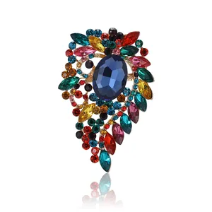 Luxurious alloy brooch featuring a large blue crystal surrounded by multi-colored gems