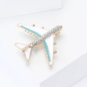 Golden aircraft brooch with white enamel and sparkling rhinestones for suits