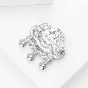 Detail view of the silver cloud brooch back with safety pin clasp and pearl pendants