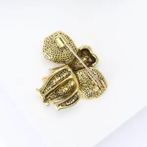 Detailed back view of vintage elephant brooch showing secure pin clasp and metal texture