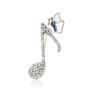 Élégante broche note de musique avec strass en cristal et motif papillon bleu