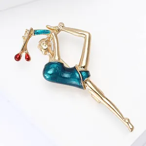 Detail of artistic gymnast brooch with blue enamel leotard and gold-tone finish