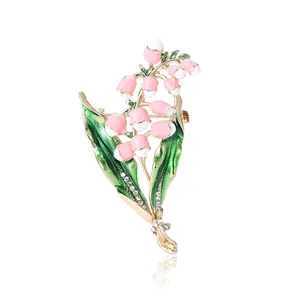 Elegant lily of the valley brooch with pink enamel flowers and rhinestones on gold base