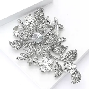 Detailed view of elegant silver alloy brooch featuring rhinestones and crystal butterfly