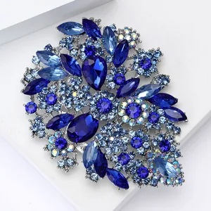 Detailed macro view of large vintage alloy brooch with multifaceted blue glass rhinestones