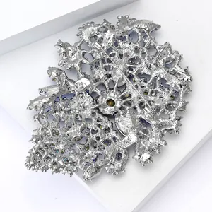 Detailed back view of vintage alloy brooch showing metal镂空 design and pin closure
