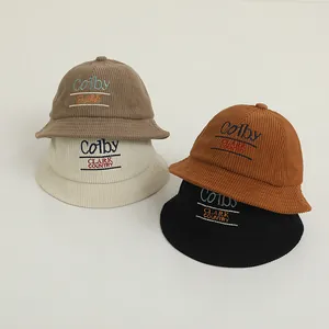 Close-up of corduroy fisherman hats showing four different colors and vintage embroidery
