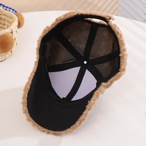 Detail of baby winter baseball cap showing soft brown fleece lining and interior structure