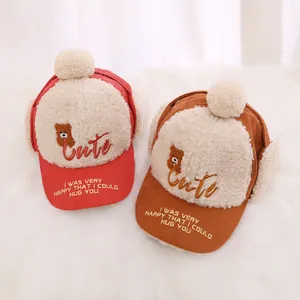 Winter corduroy baby earflap hat with fleece lining and cute bear embroidery