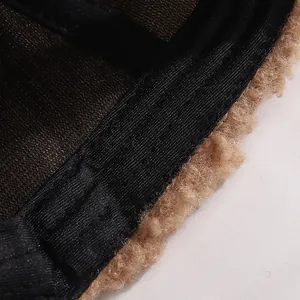 Detailed interior view showing breathable mesh lining and plush faux shearling trim of the hat