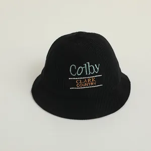 Detail of black corduroy bucket hat with blue Colby and orange Clark Country embroidery
