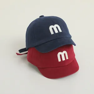 Kids cotton baseball cap with embroidered letter M in navy blue and red colors