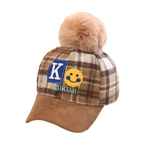 Cute kids checkered winter baseball cap with plush fur pompom and letter K embroidery