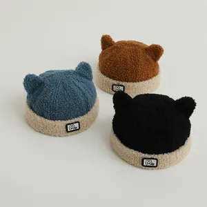 Winter fleece beanies for kids featuring cute small horns and an 'M' logo patch