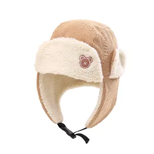 Khaki corduroy kids winter trapper hat with warm sherpa lining and bear embroidery