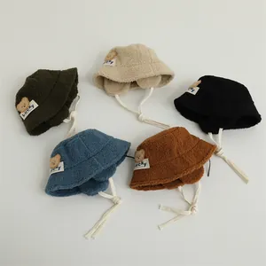 Fleece bucket hat collection in five colors with earflaps and Lucky bear patch