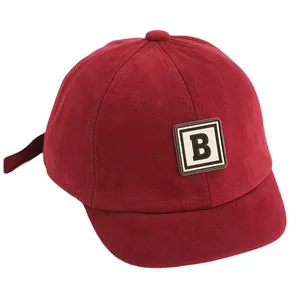 Kids vintage red baseball cap with a letter B patch and short brim in soft cotton