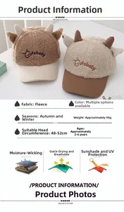 Detail of plush baby baseball cap with cute horns and embroidery for autumn winter