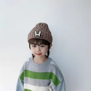 Kids warm winter knit hat in brown with H letter patch and rib texture for toddlers