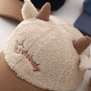 Plush baby baseball cap with cartoon horns and Cutebaby embroidery in beige and brown