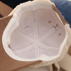 Detailed interior of a warm plush baseball cap showing stitching and soft fleece lining