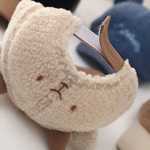 Detail of adjustable corduroy back strap on plush sherpa baby baseball hat