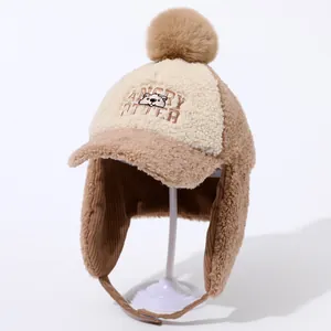 Close-up of the plush fleece winter hat with earflaps and an embroidered otter design
