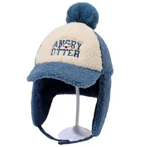 Blue and white plush winter trapper hat for kids with pompom and earflaps