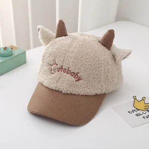 Detailed view of plush lamb wool baby cap with cute 3D horns and Cutebaby embroidery